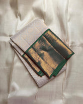 Varnika – Ivory Kanjivaram Silk Saree with Emerald Zari Border