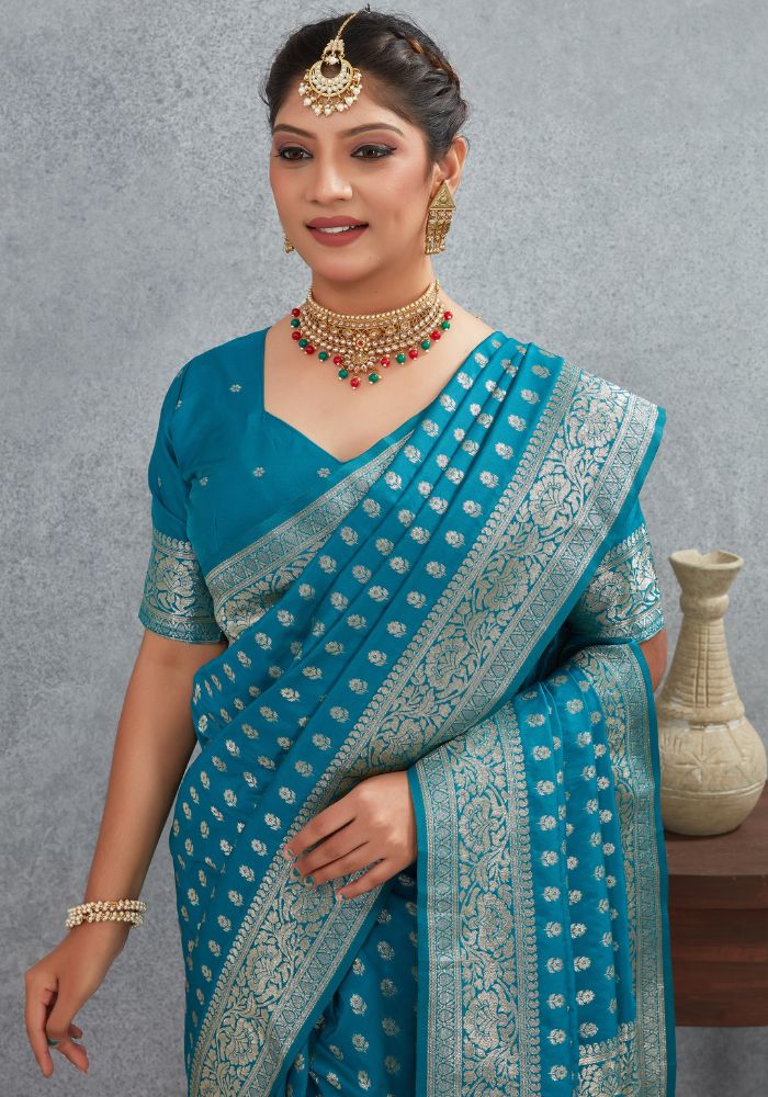 Charmi Teal Blue Banarasi Soft Silk Saree